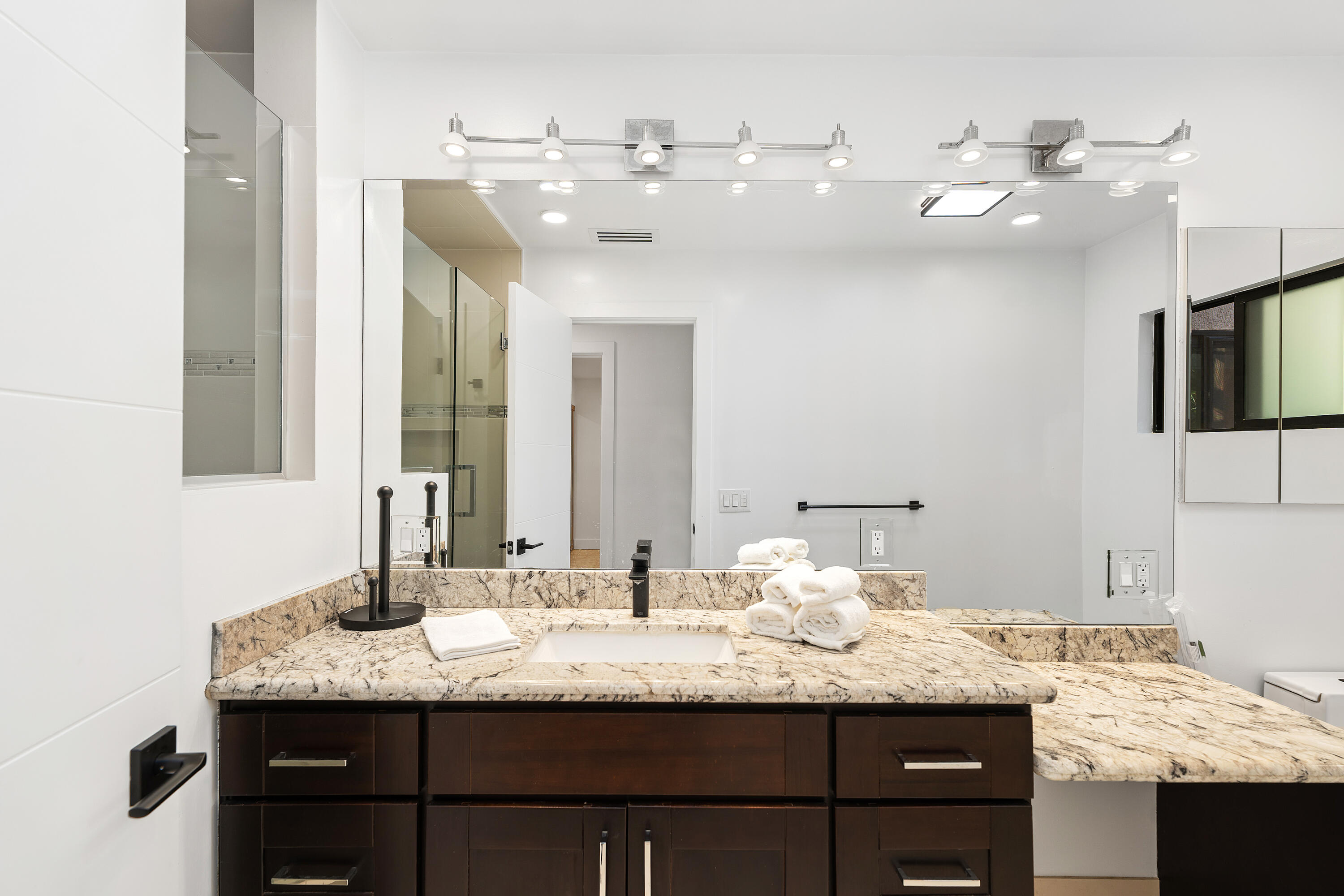 72114 Follansbee Road Rancho Mirage, CA 92270 - Photo 37 of 58 a bathroom with a granite countertop sink and a mirror