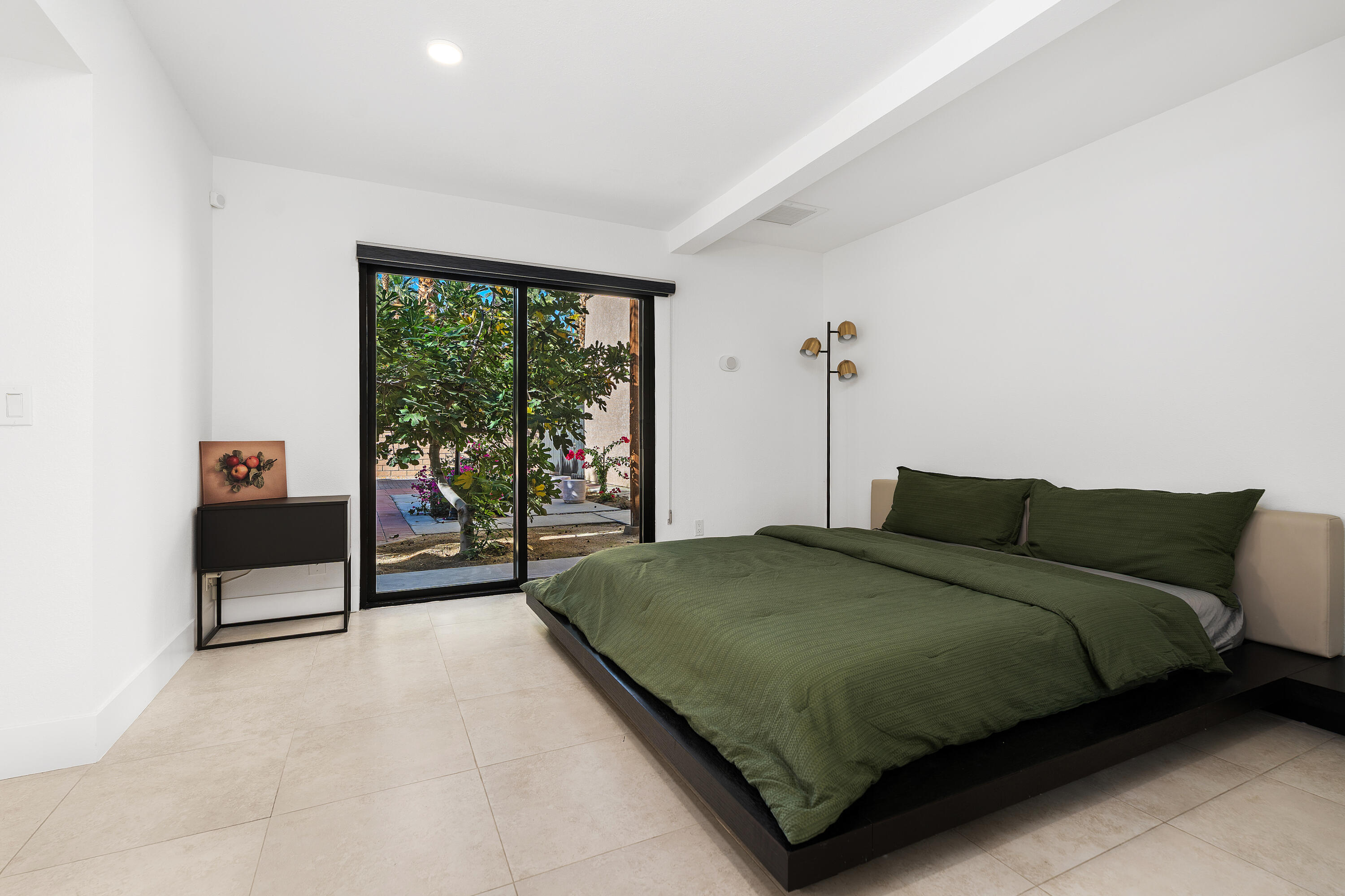 72114 Follansbee Road Rancho Mirage, CA 92270 - Photo 40 of 58 a bedroom with a bed and large window