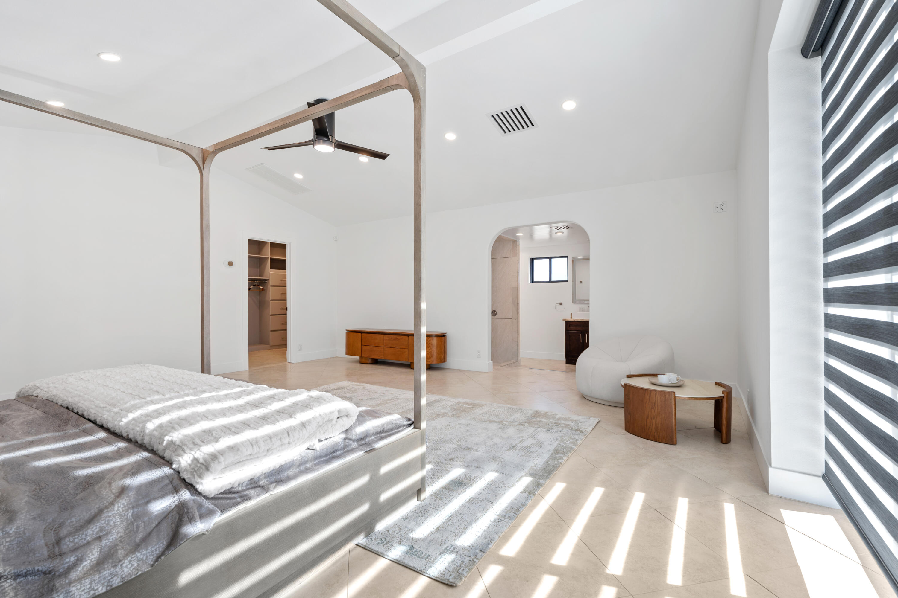 72114 Follansbee Road Rancho Mirage, CA 92270 - Photo 44 of 58 a bedroom with a bed and a chandelier