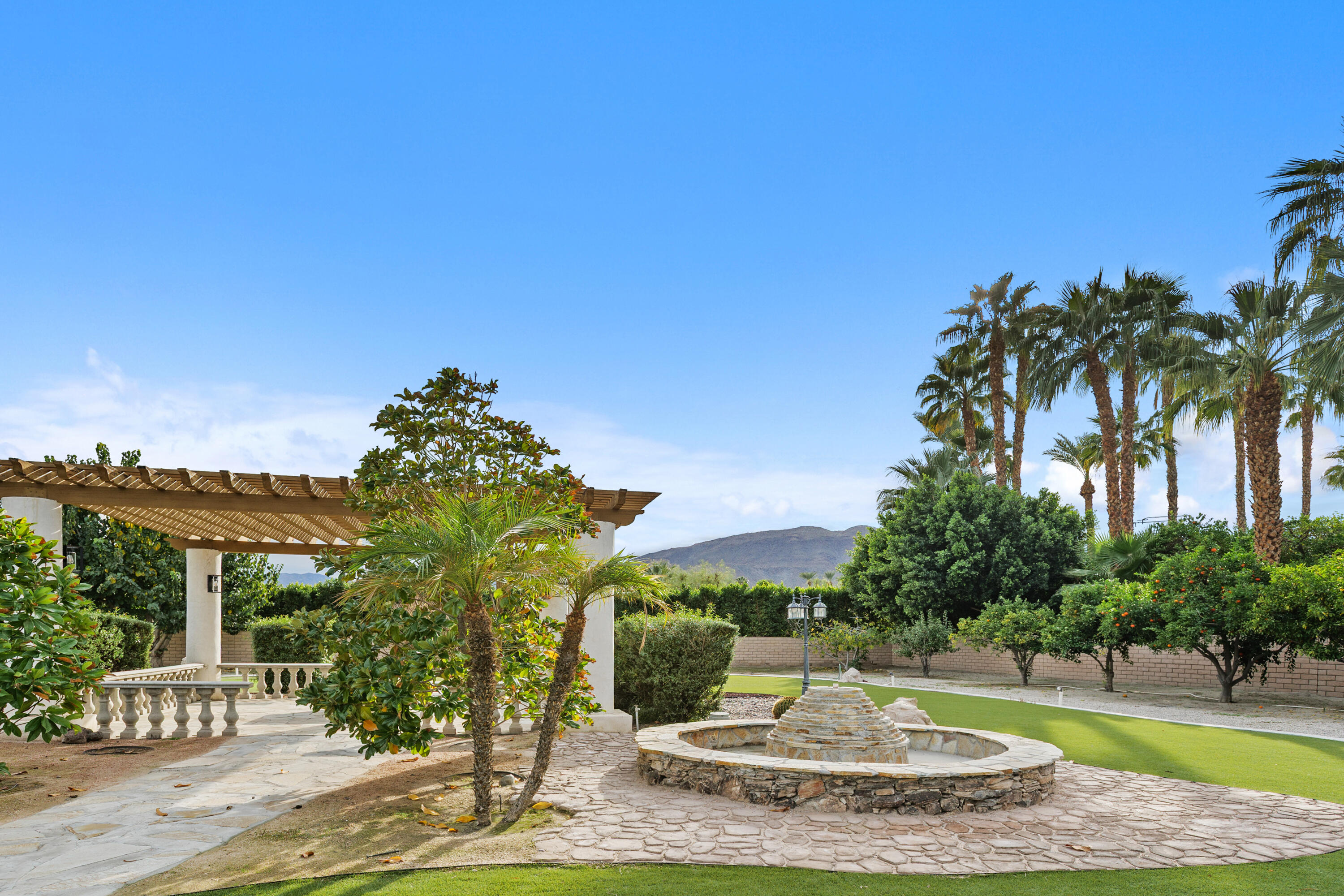 72114 Follansbee Road Rancho Mirage, CA 92270 - Photo 54 of 58 a view of a water fountain in front of the house