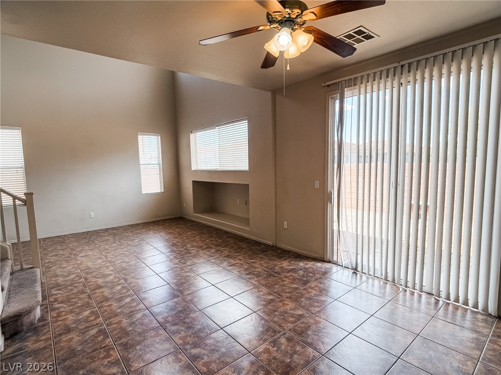 228 Positive Point Street Henderson, NV 89012 - Photo 9 of 27 A spacious living area with soaring ceilings and durable tiled flooring awaits.