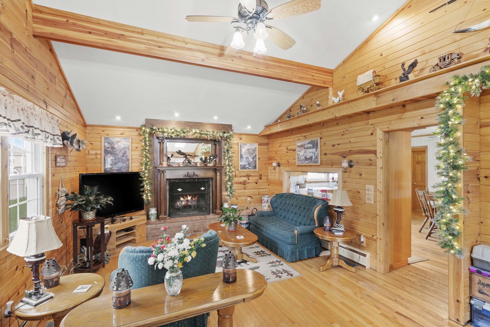 200 South Rathje Road Peotone, IL 60468 - Photo 11 of 39 a living room with patio fireplace furniture and a flat screen tv