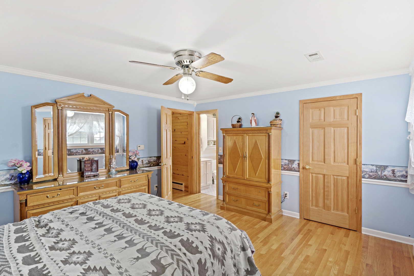 200 South Rathje Road Peotone, IL 60468 - Photo 18 of 39 a bedroom with a bed and wooden floor