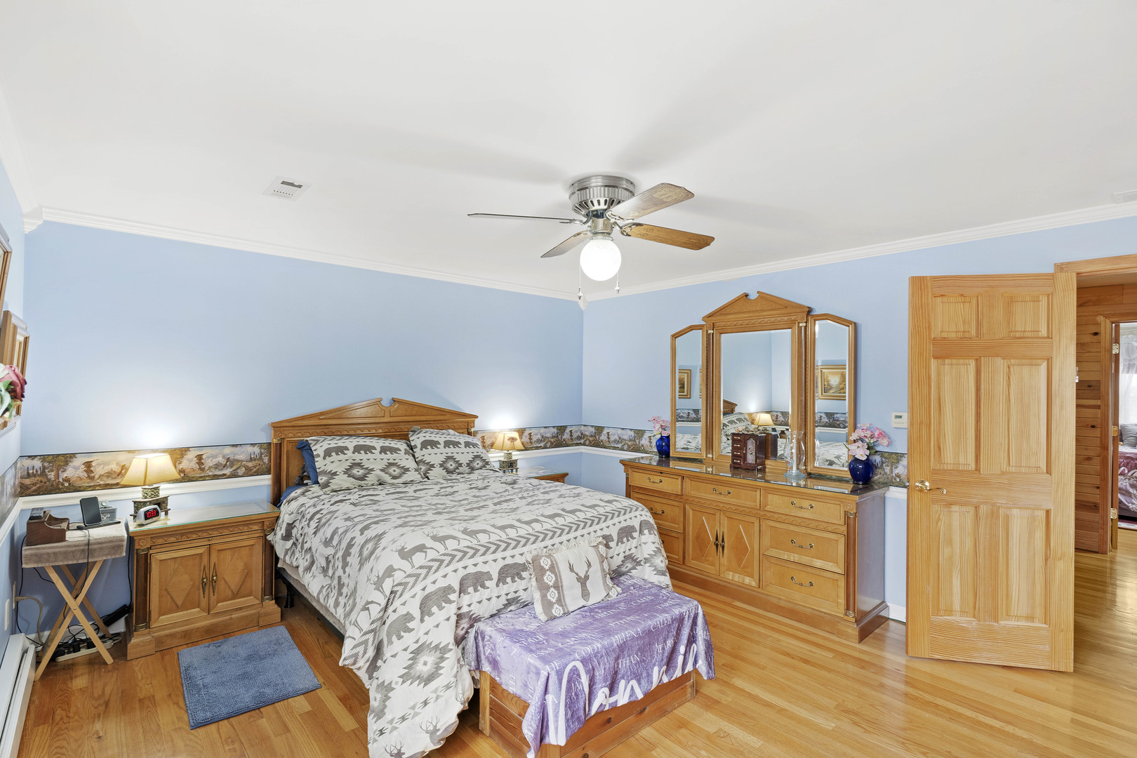 200 South Rathje Road Peotone, IL 60468 - Photo 20 of 39 a bedroom with a bed and wooden floor