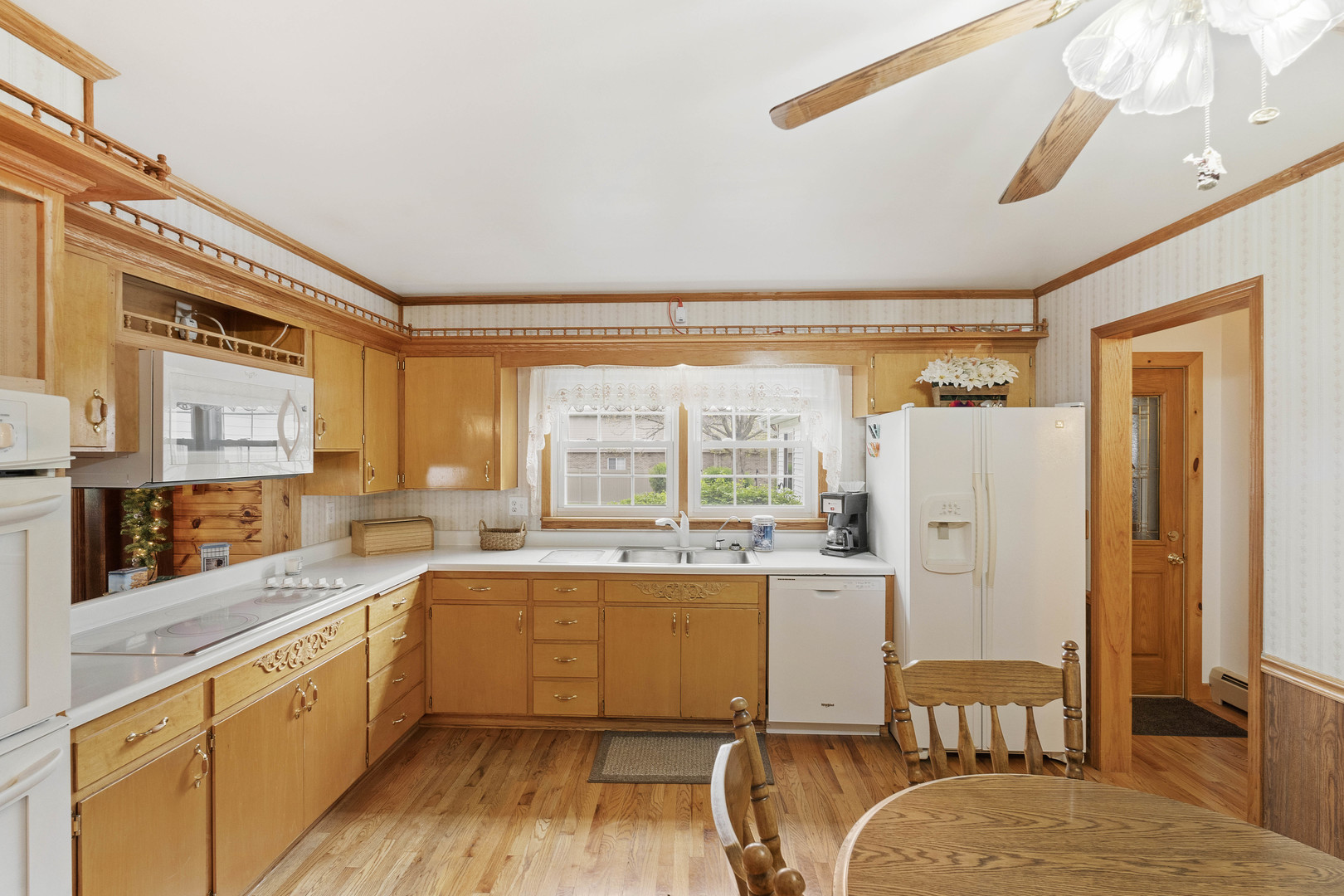 200 South Rathje Road Peotone, IL 60468 - Photo 6 of 39 a kitchen with a window a sink and a refrigerator