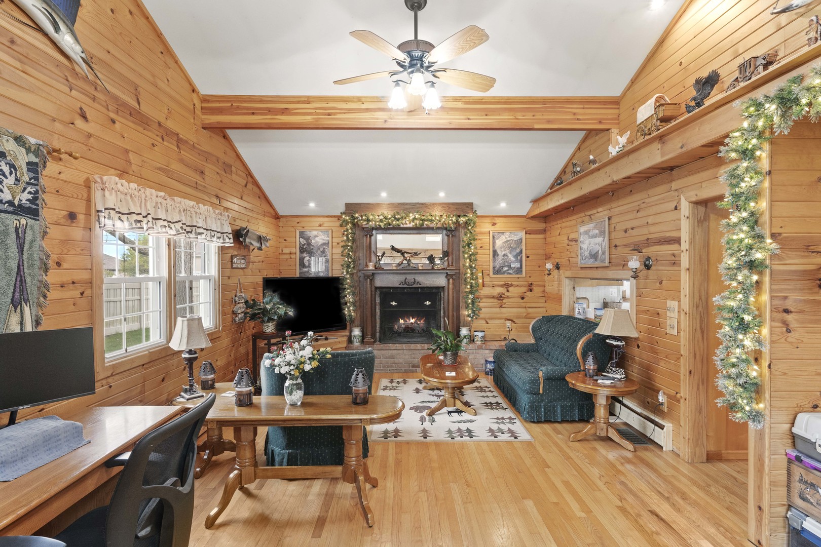 200 South Rathje Road Peotone, IL 60468 - Photo 9 of 39 a living room with furniture a fireplace and a flat screen tv
