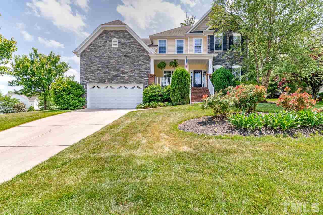 103 Key Biscayne Court Raleigh, NC 27603 - Photo 1 of 30 a front view of a house with a garden