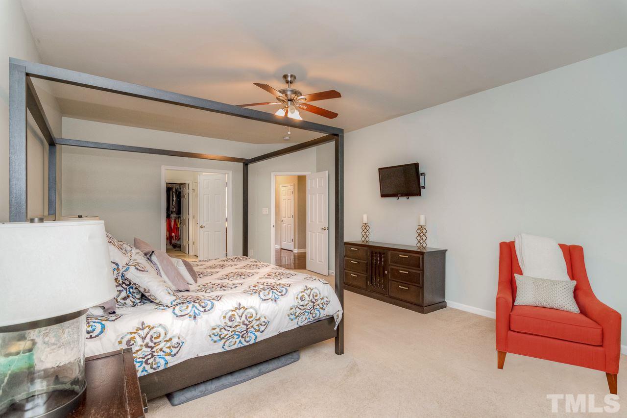 103 Key Biscayne Court Raleigh, NC 27603 - Photo 14 of 30 a bedroom with a bed and a couch