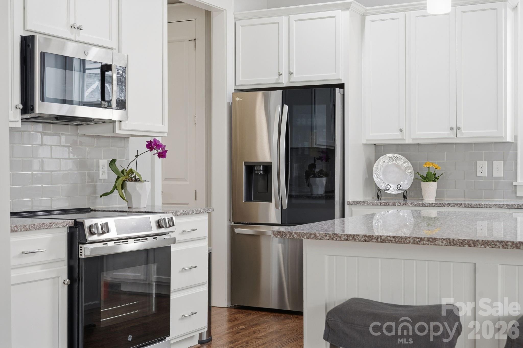 312 Mill Ridge Road Rock Hill, SC 29730 - Photo 11 of 42 a kitchen with stainless steel appliances granite countertop a refrigerator stove and sink