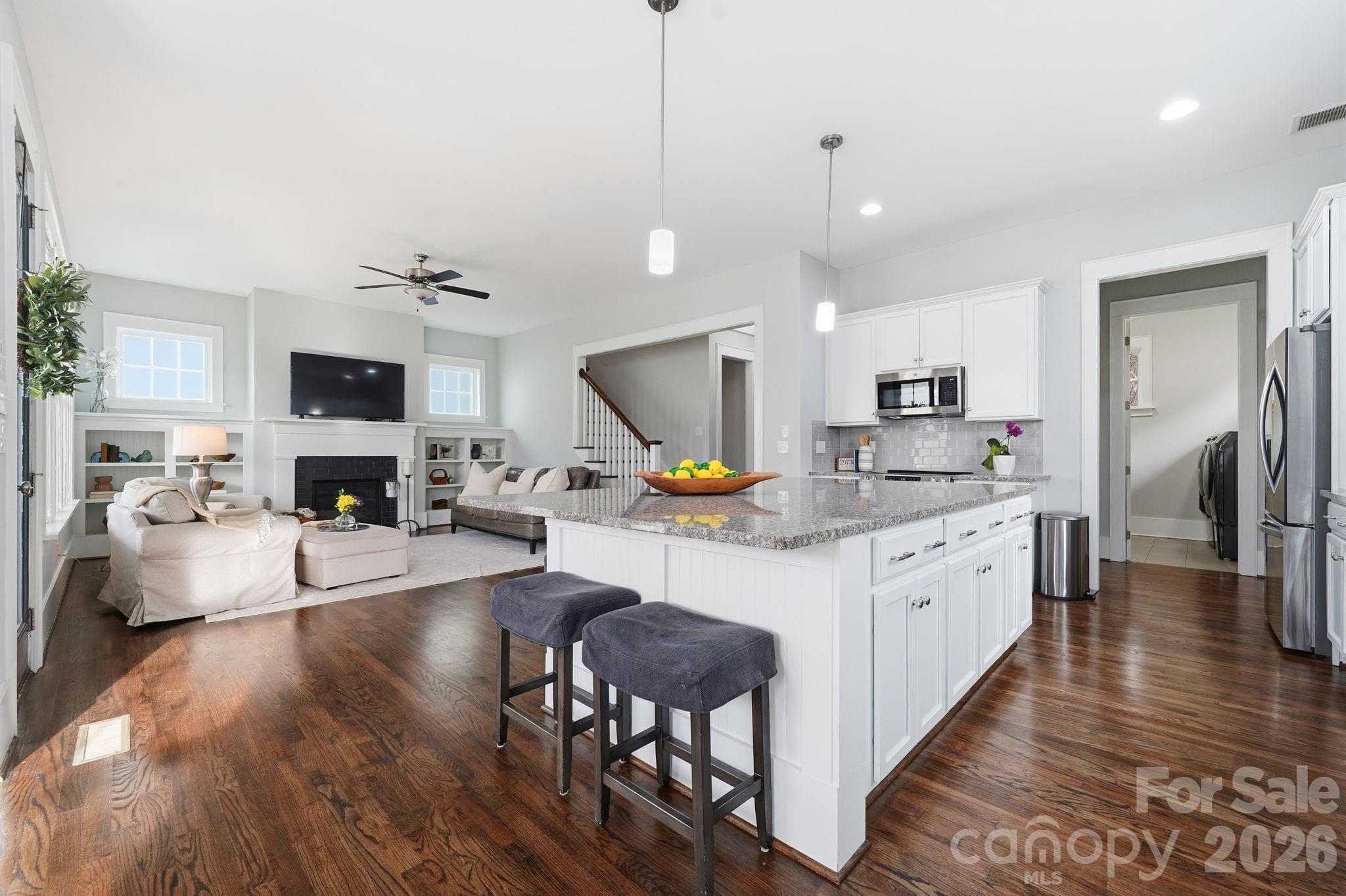 312 Mill Ridge Road Rock Hill, SC 29730 - Photo 13 of 42 a large kitchen with stainless steel appliances granite countertop a lot of counter space and wooden floor