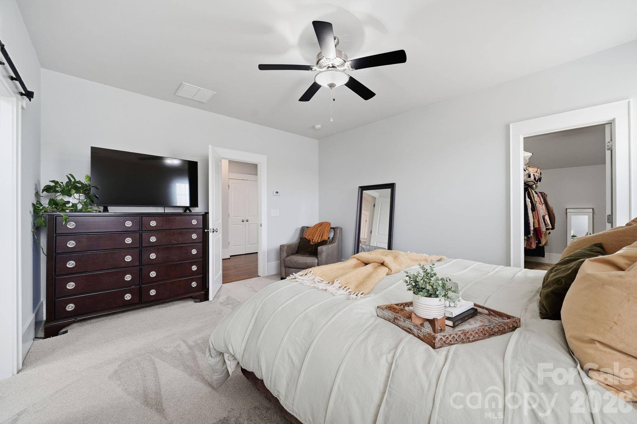 312 Mill Ridge Road Rock Hill, SC 29730 - Photo 23 of 42 a bedroom with a bed and a flat tv screen on dresser