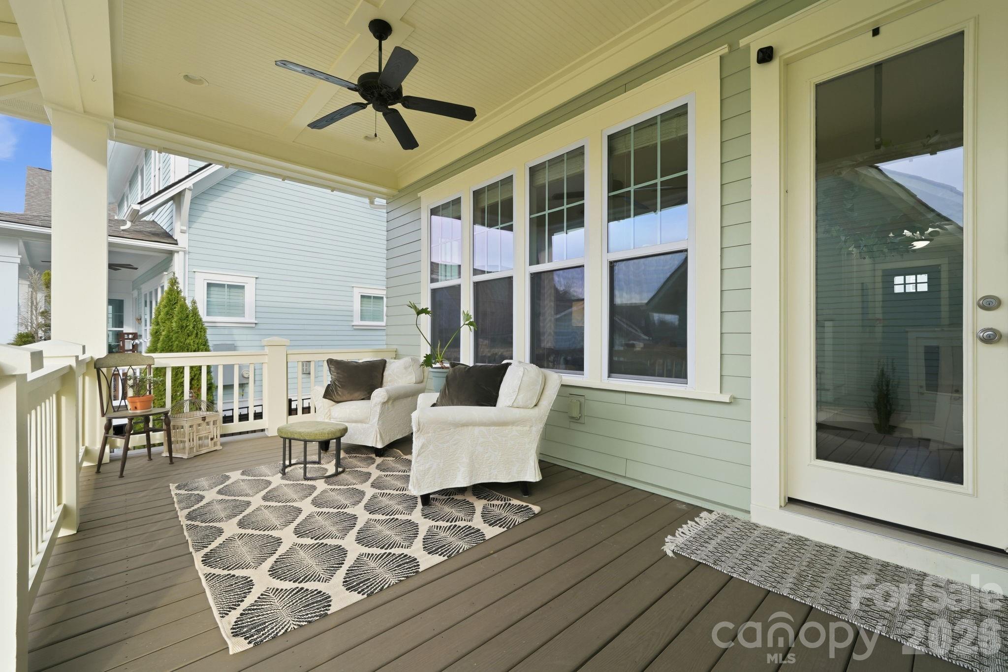 312 Mill Ridge Road Rock Hill, SC 29730 - Photo 39 of 42 a living room with couches a dining table and chairs with wooden floor