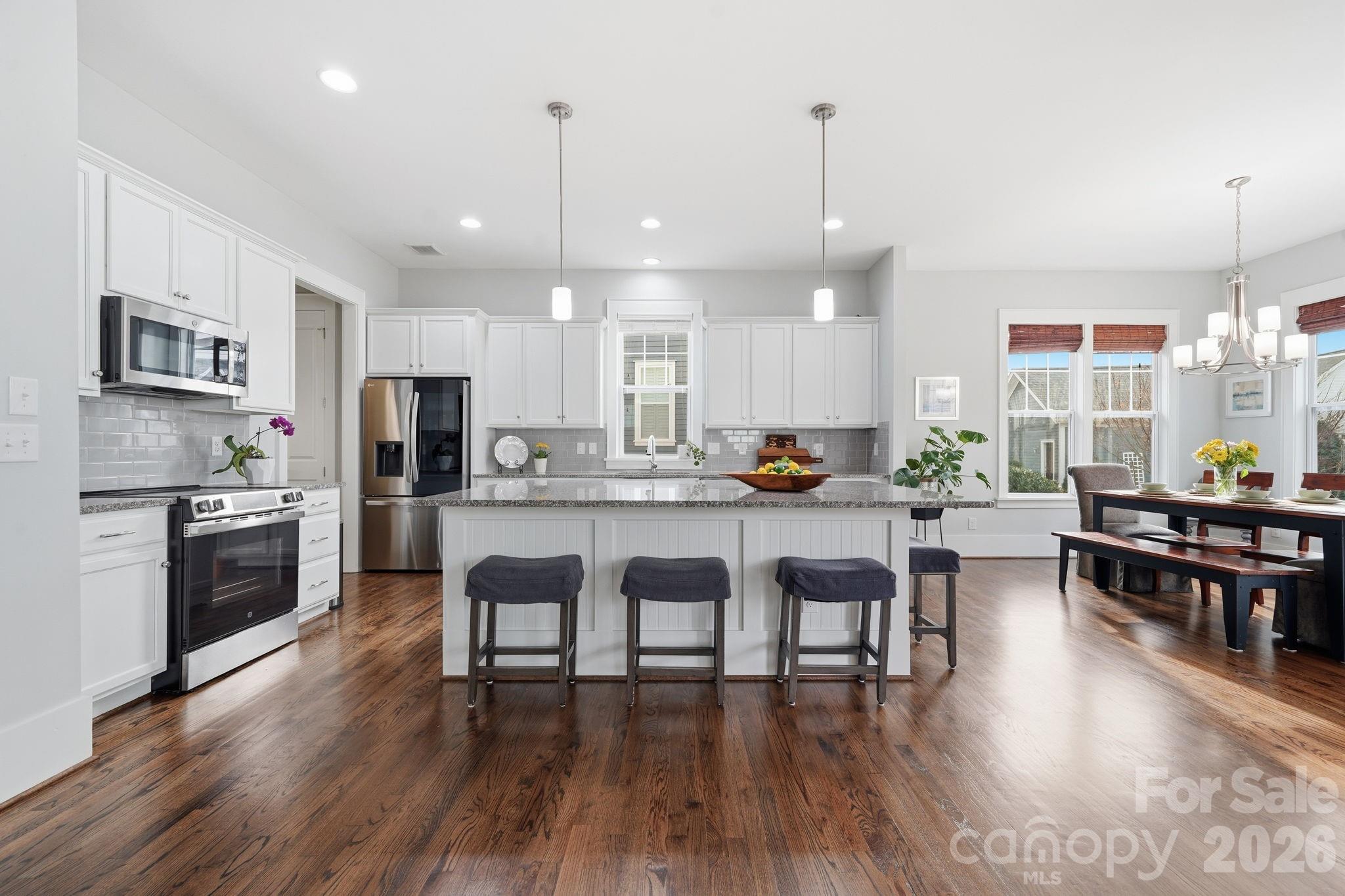 312 Mill Ridge Road Rock Hill, SC 29730 - Photo 8 of 42 a living room with stainless steel appliances kitchen island granite countertop furniture a dining table and chairs
