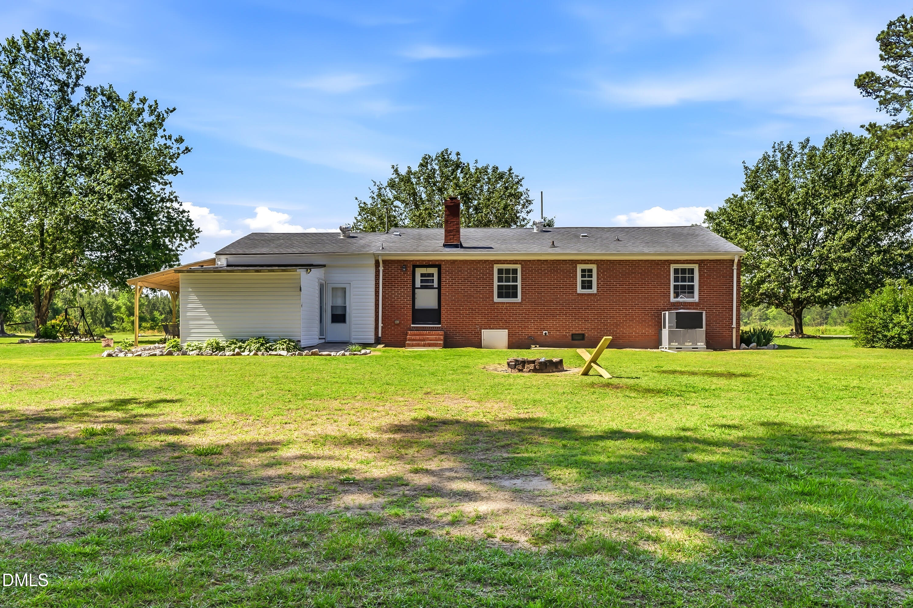 4967 Highway 581 Spring Hope, NC 27882 - Photo 9 of 44 a view of a house with a backyard