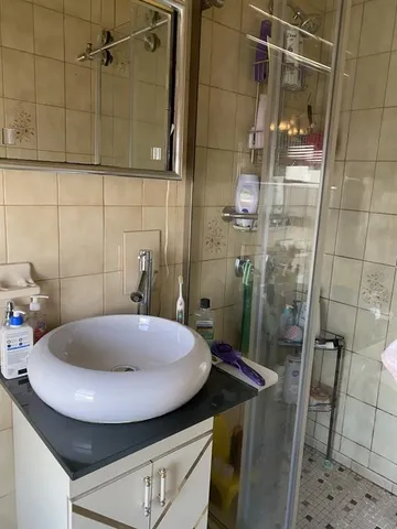 a bathroom with a sink and shower