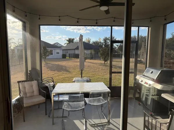 a dining room with furniture and window