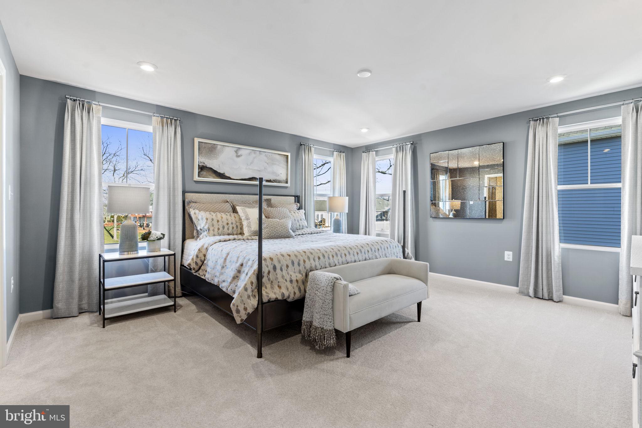 354 National Street Ranson, WV 25438 - Photo 9 of 39 a bedroom with a bed lamp and a large window