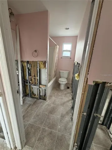 a view of a livingroom with a staircase