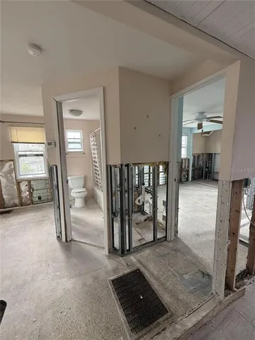 a view of empty room with stairs and furniture