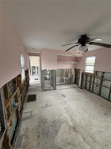 a view of a livingroom with a chair and closet
