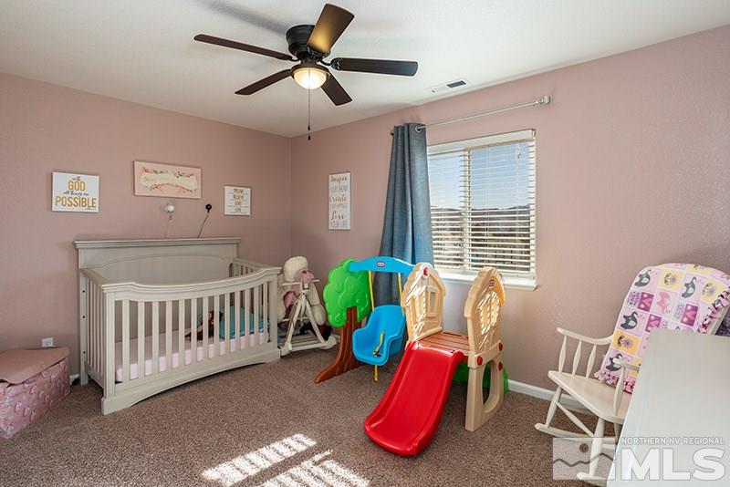 18366 Whitebark Court Reno, NV 89508 - Photo 12 of 36 a bed room with a bed and a window