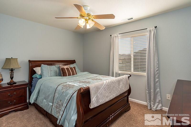 18366 Whitebark Court Reno, NV 89508 - Photo 13 of 36 a bedroom with a bed and a window