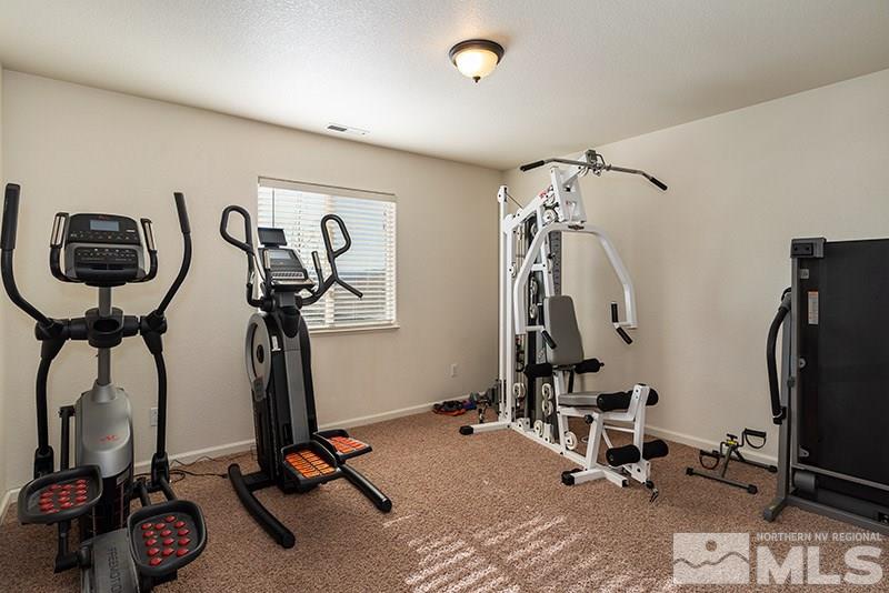 18366 Whitebark Court Reno, NV 89508 - Photo 14 of 36 a view of a room with gym equipment