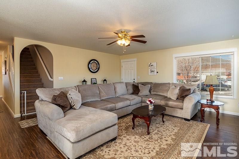 18366 Whitebark Court Reno, NV 89508 - Photo 17 of 36 a living room with furniture and a large window