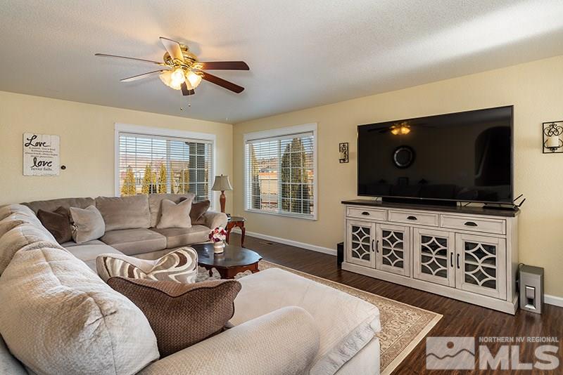 18366 Whitebark Court Reno, NV 89508 - Photo 18 of 36 a living room with furniture and a flat screen tv
