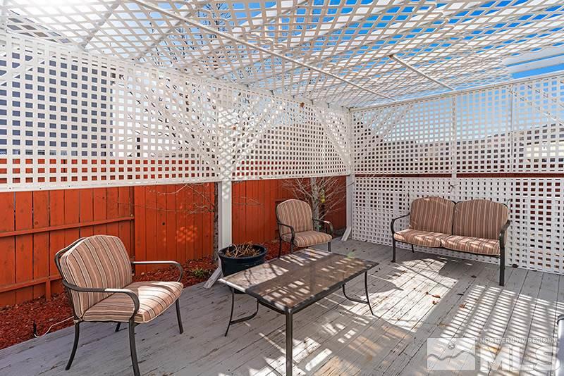 18366 Whitebark Court Reno, NV 89508 - Photo 24 of 36 a backyard of a house with outdoor seating