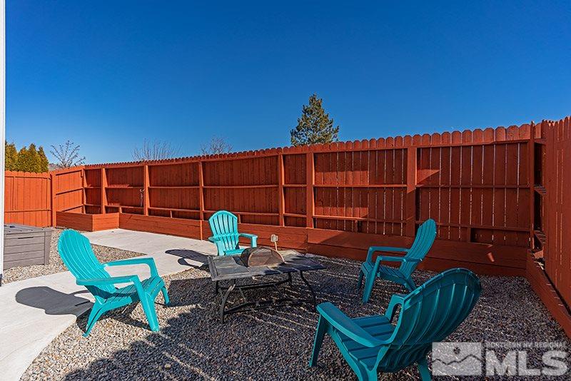 18366 Whitebark Court Reno, NV 89508 - Photo 26 of 36 a backyard view with a seating space