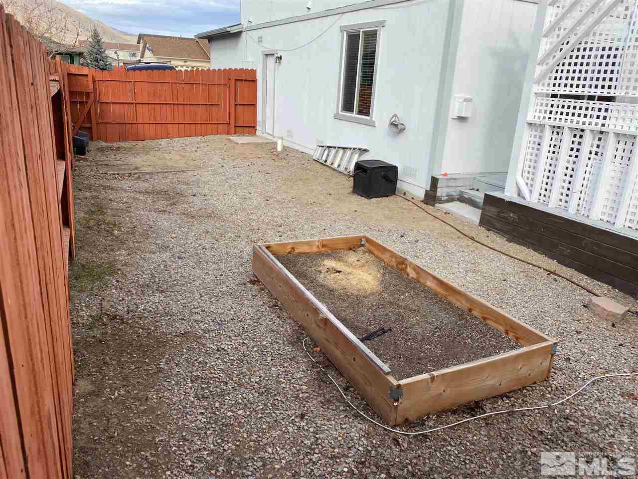 18366 Whitebark Court Reno, NV 89508 - Photo 35 of 36 a living room with a rug