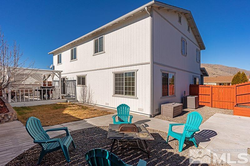 18366 Whitebark Court Reno, NV 89508 - Photo 6 of 36 a view of a house with backyard and sitting area