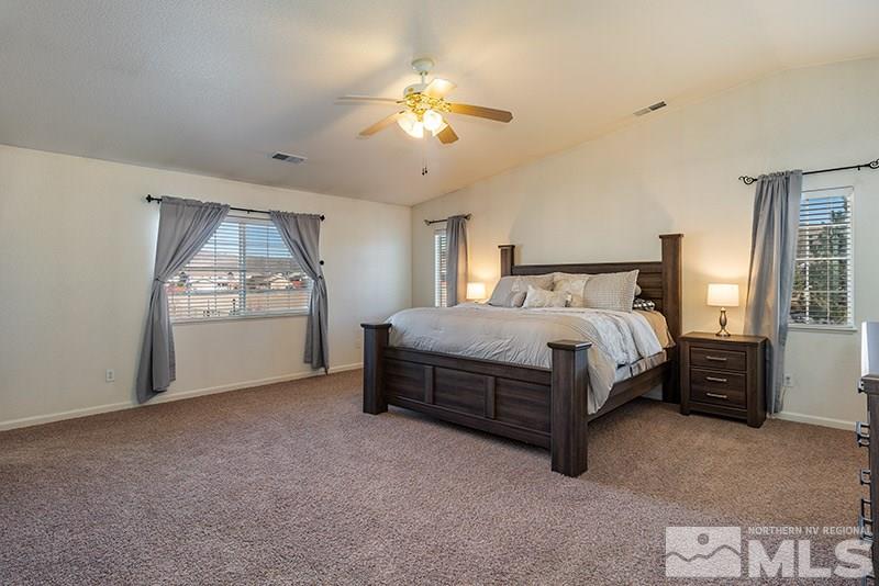 18366 Whitebark Court Reno, NV 89508 - Photo 7 of 36 a spacious bedroom with a bed and window