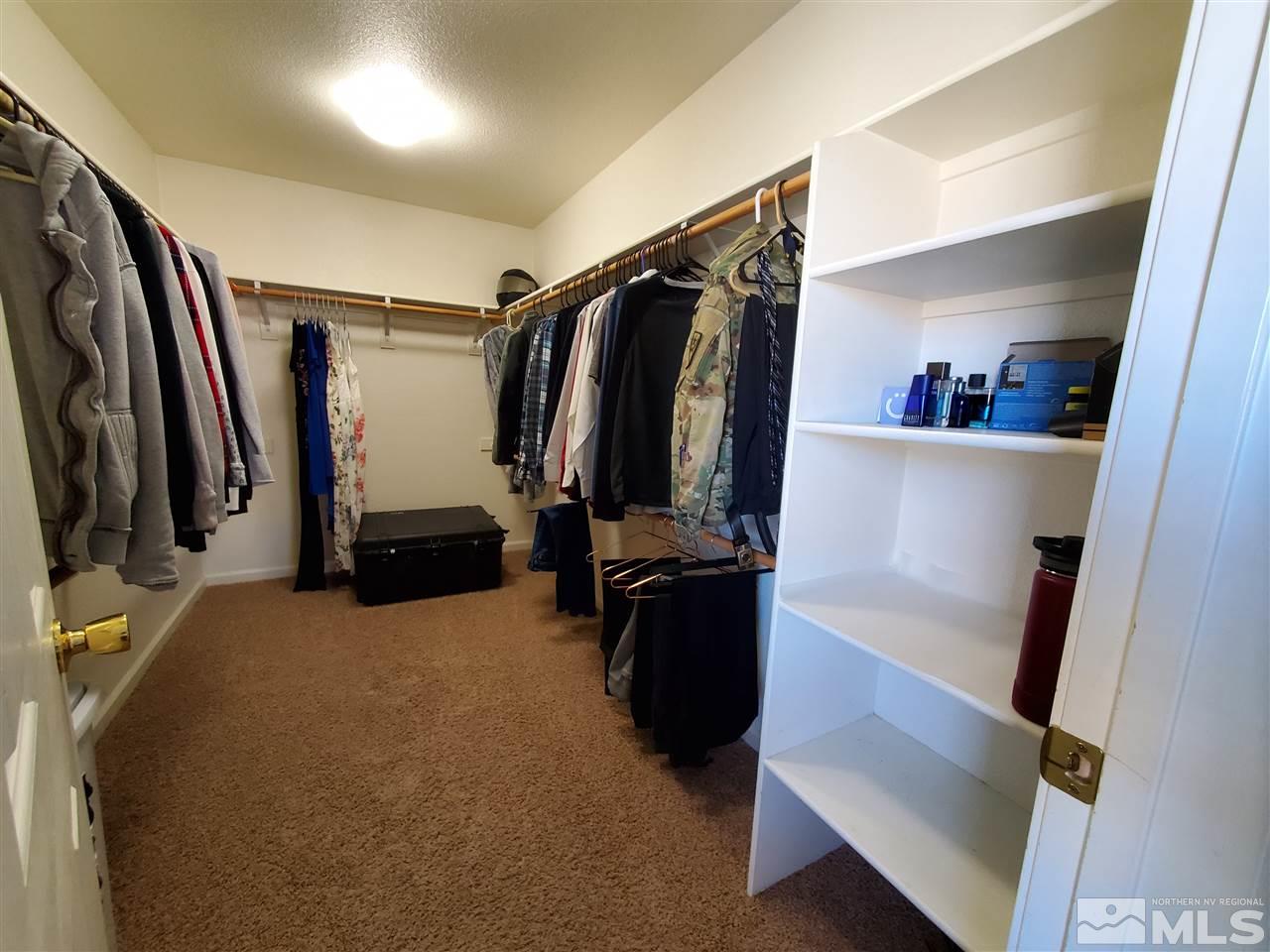 18366 Whitebark Court Reno, NV 89508 - Photo 8 of 36 a view of walk in closet with clothes and shoes
