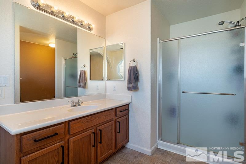 18366 Whitebark Court Reno, NV 89508 - Photo 10 of 36 a bathroom with a sink and a mirror