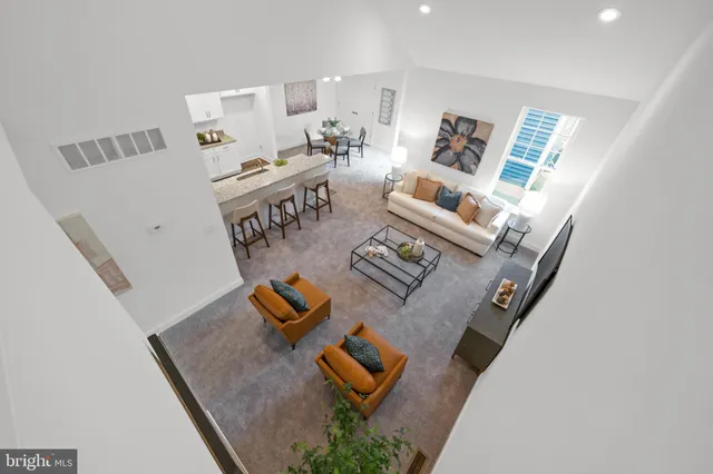 wooden floor living room with furniture and floor to ceiling windows