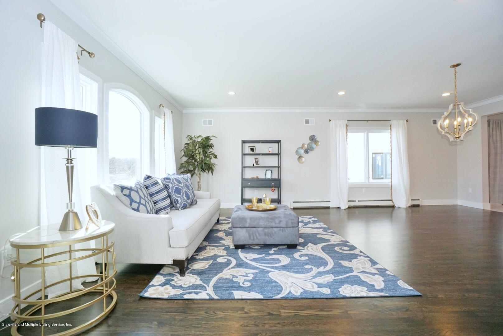 31 Torrice Loop Staten Island, NY 10309 - Photo 11 of 69 a living room with furniture and a wooden floor