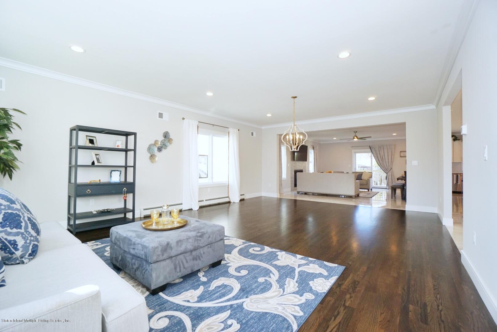 31 Torrice Loop Staten Island, NY 10309 - Photo 12 of 69 a living room with furniture and wooden floor