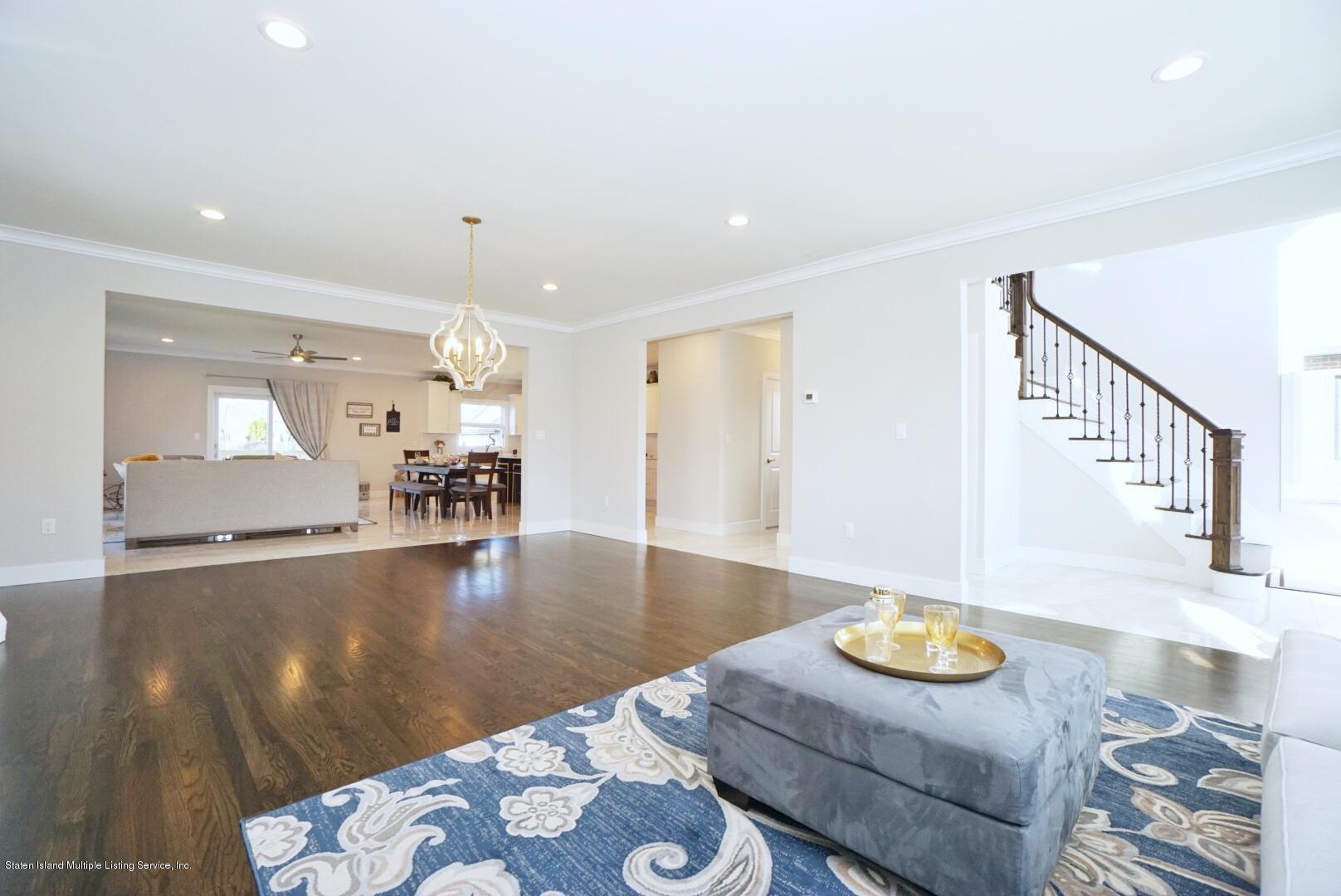 31 Torrice Loop Staten Island, NY 10309 - Photo 13 of 69 a view of kitchen and dining room with wooden floor