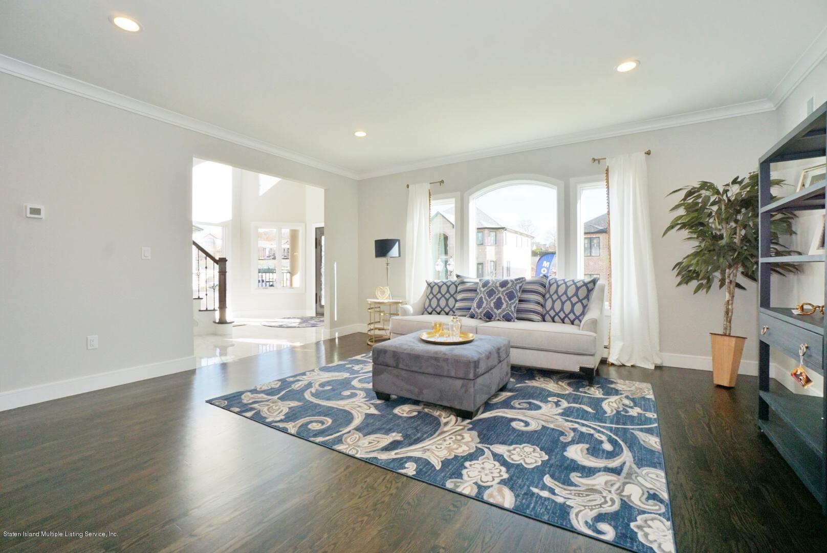 31 Torrice Loop Staten Island, NY 10309 - Photo 14 of 69 a living room with furniture and a large window