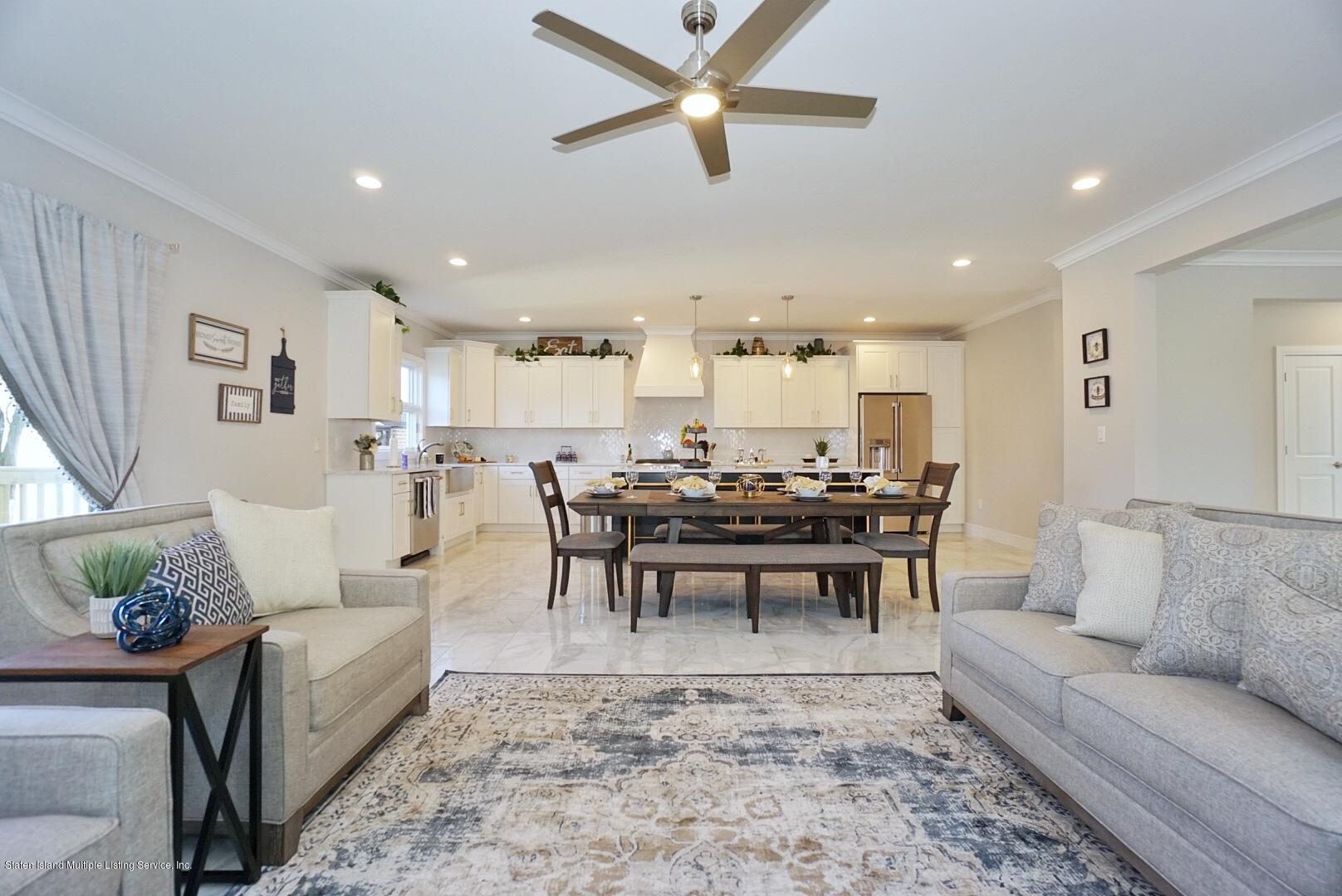 31 Torrice Loop Staten Island, NY 10309 - Photo 23 of 69 a living room with furniture and view of kitchen