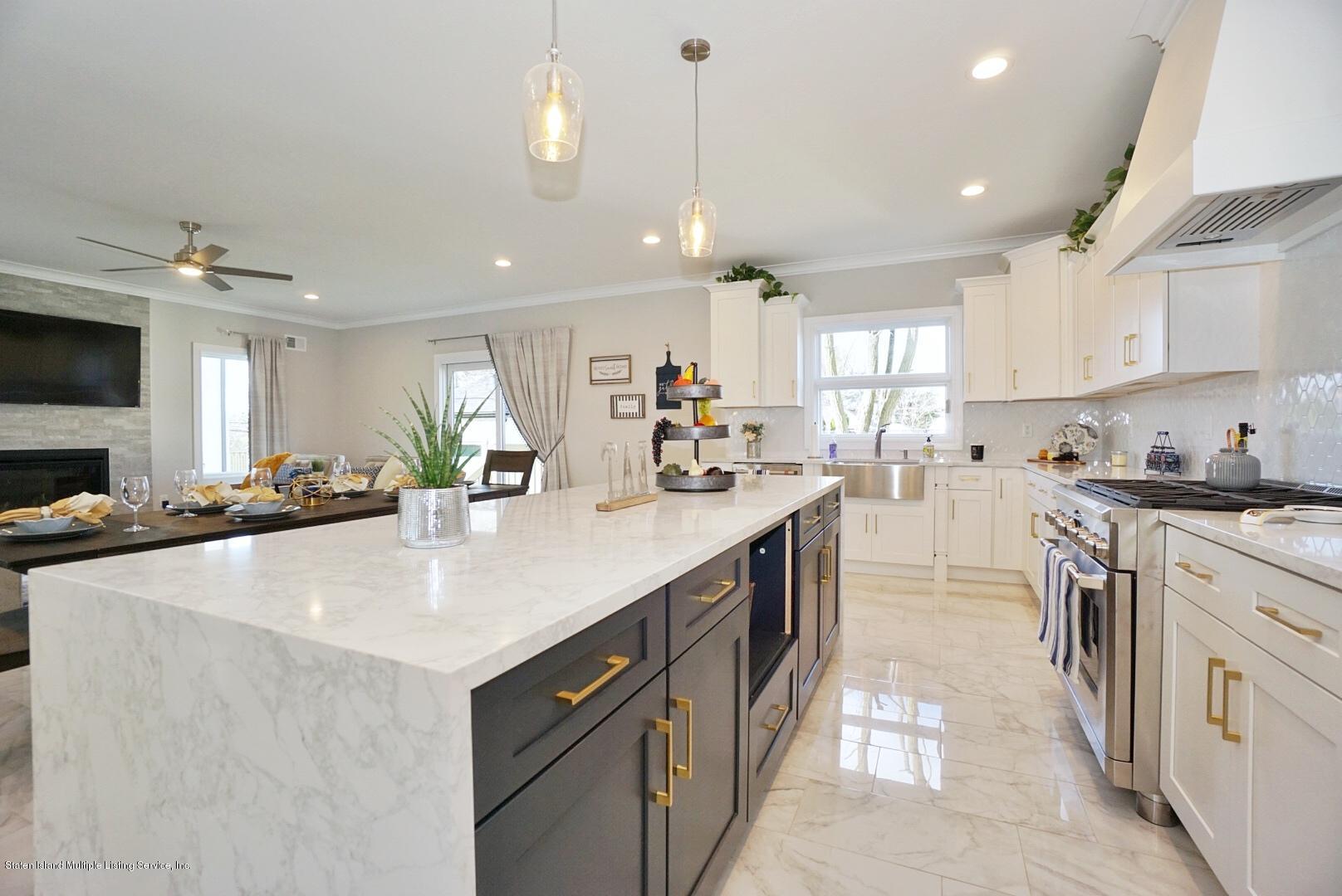 31 Torrice Loop Staten Island, NY 10309 - Photo 28 of 69 a kitchen with stainless steel appliances granite countertop a sink a stove and a refrigerator
