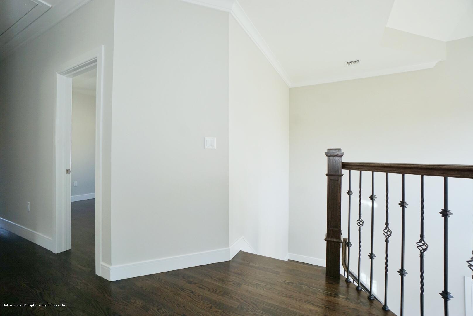 31 Torrice Loop Staten Island, NY 10309 - Photo 35 of 69 a view of a hallway with wooden floor