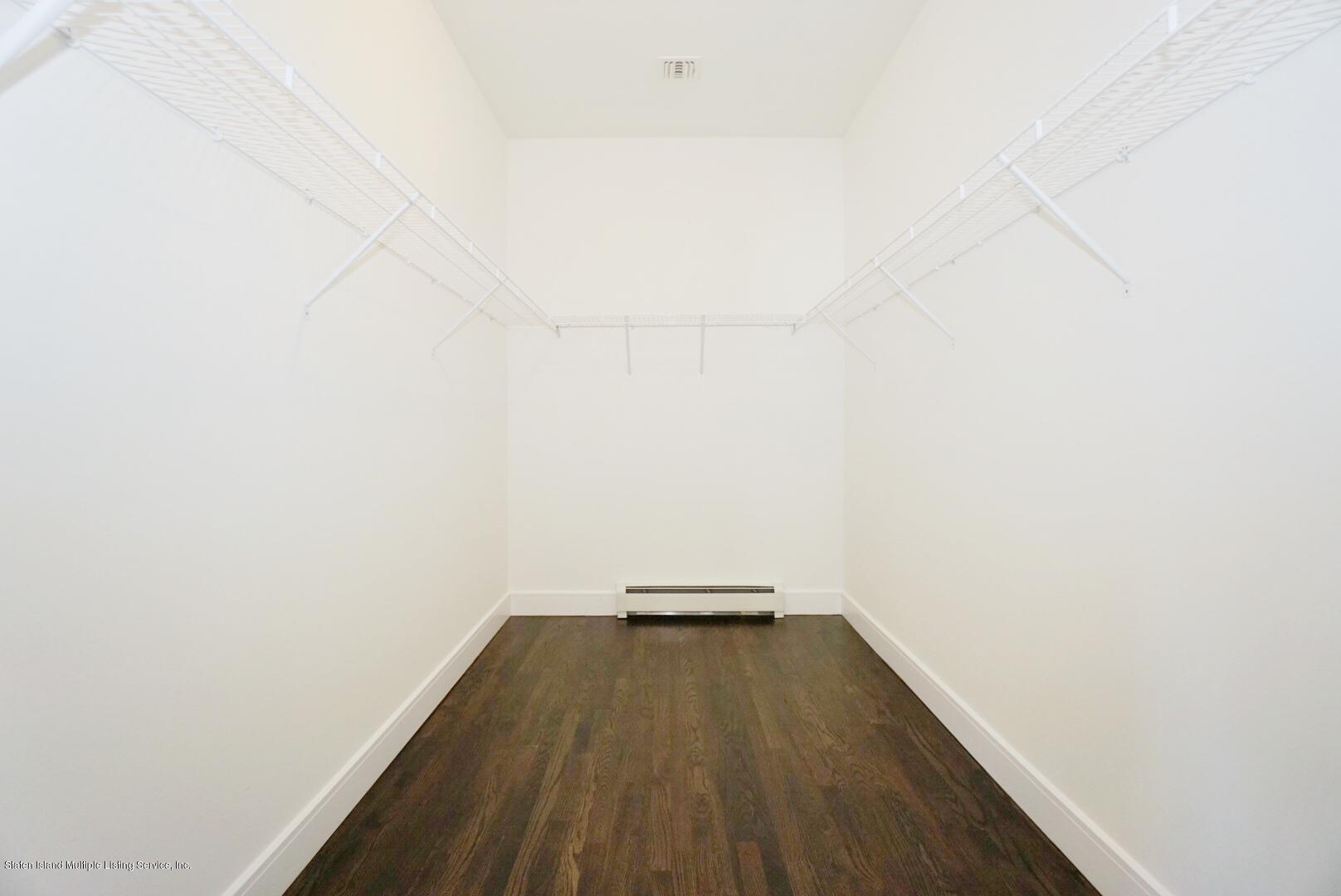 31 Torrice Loop Staten Island, NY 10309 - Photo 41 of 69 a view of a small space with wooden floor