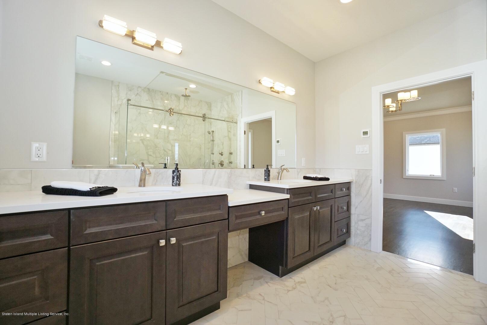 31 Torrice Loop Staten Island, NY 10309 - Photo 51 of 69 a bathroom with a sink double vanity and a mirror