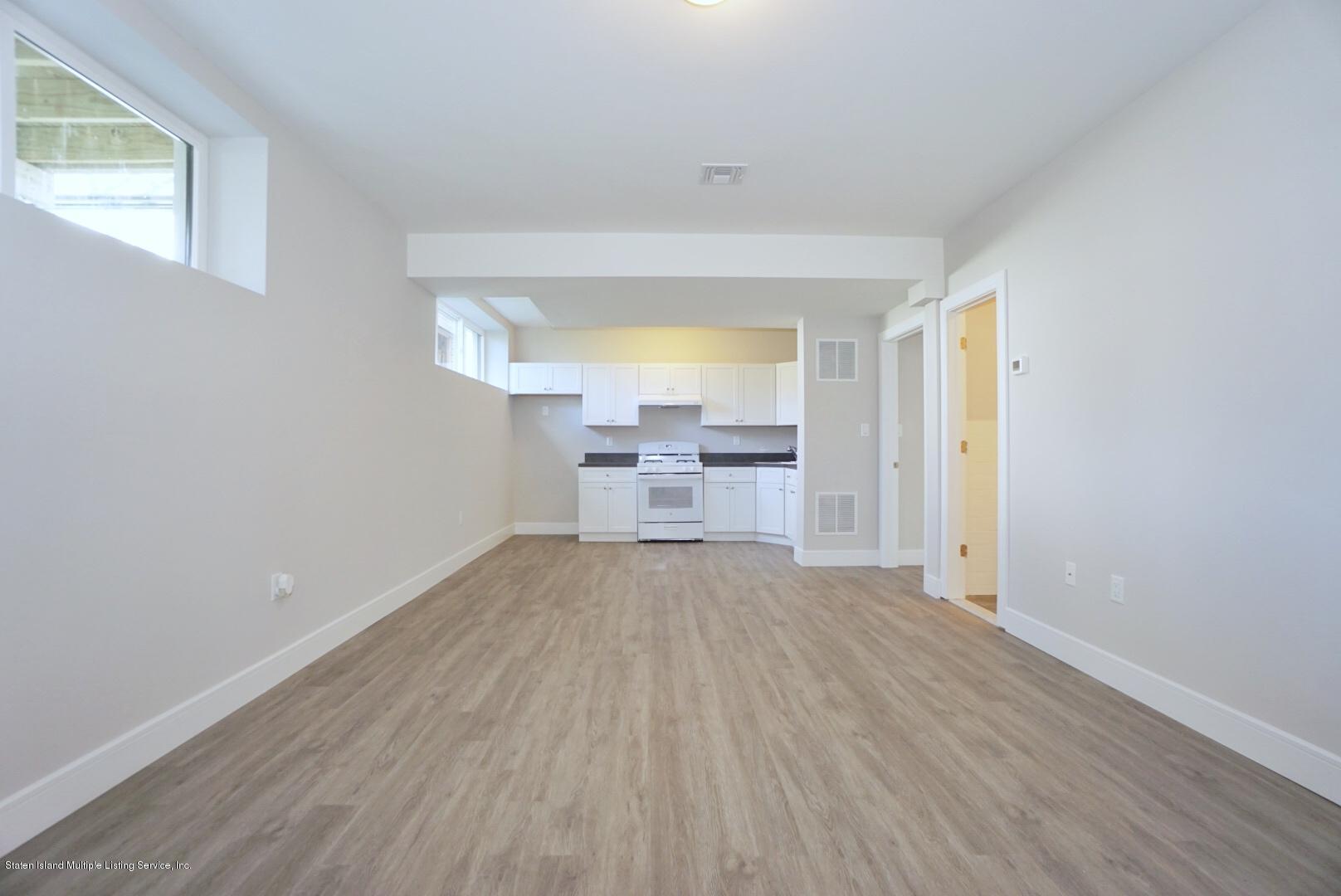 31 Torrice Loop Staten Island, NY 10309 - Photo 55 of 69 a view of a room with wooden floor and a window