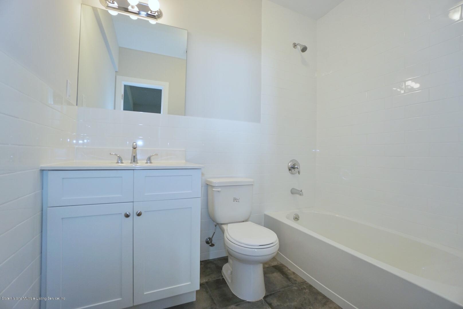 31 Torrice Loop Staten Island, NY 10309 - Photo 61 of 69 a bathroom with a sink toilet and shower