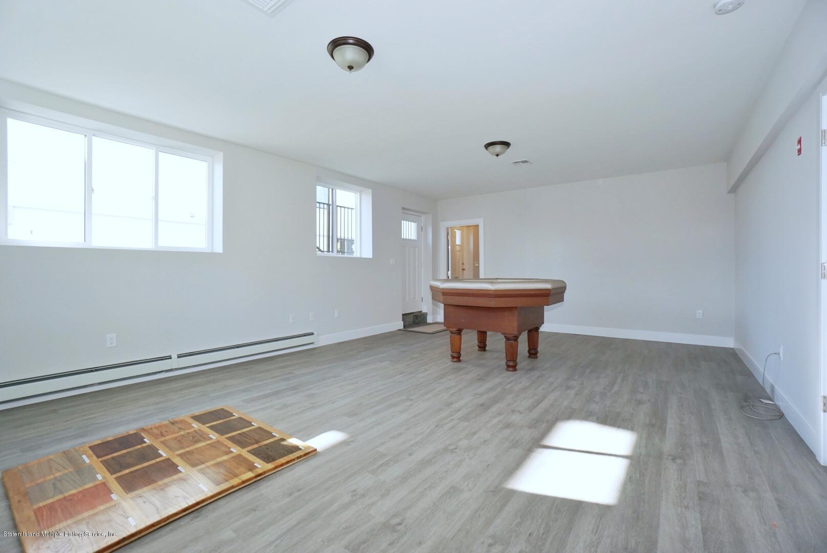 31 Torrice Loop Staten Island, NY 10309 - Photo 64 of 69 a room with gym equipment and a window