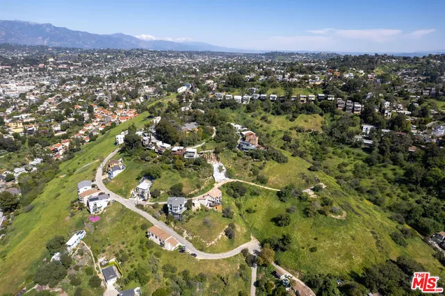 an aerial view of residential house and green space